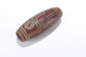 A TIBETAN EYED DZI BEAD<br>A T