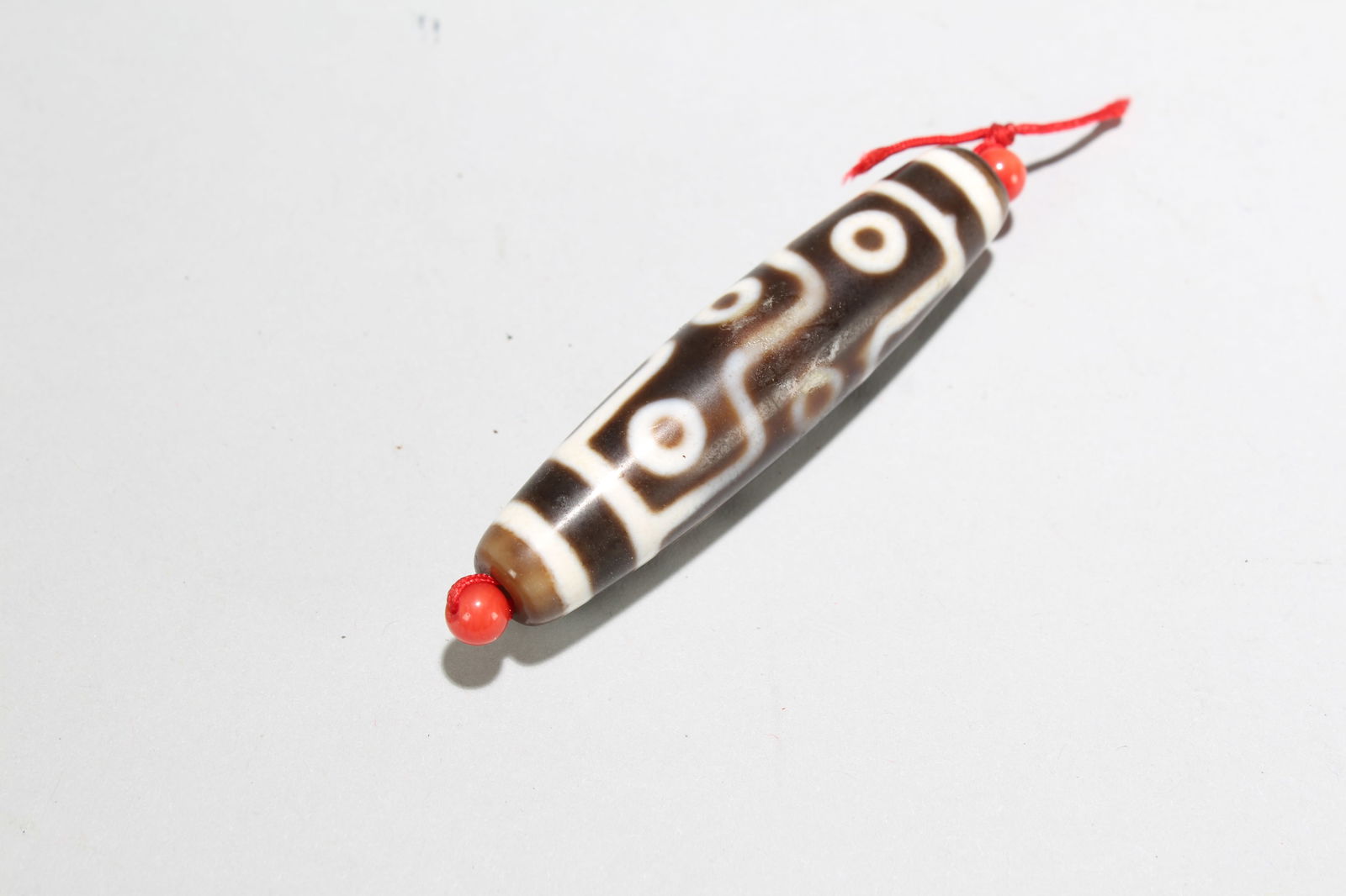 A TIBETAN FORTUNE DZI BEADA Tibetan