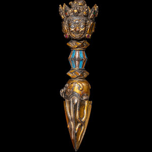 A Tibetan Gilt and Painted Bronze