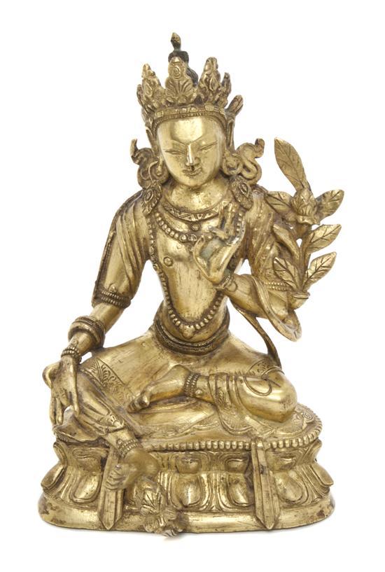 A Tibetan Gilt Bronze Figure of a