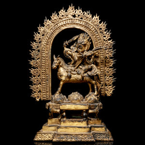 A Tibetan Gilt Bronze Figure of