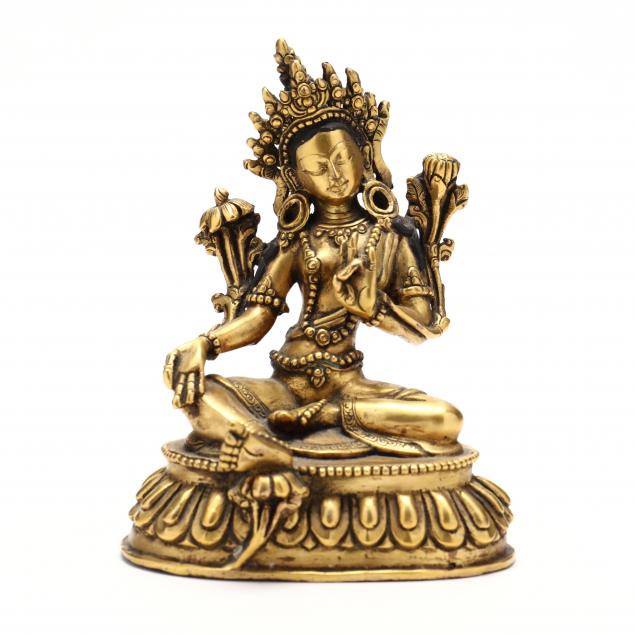 A TIBETAN GILT BRONZE SCULPTURE