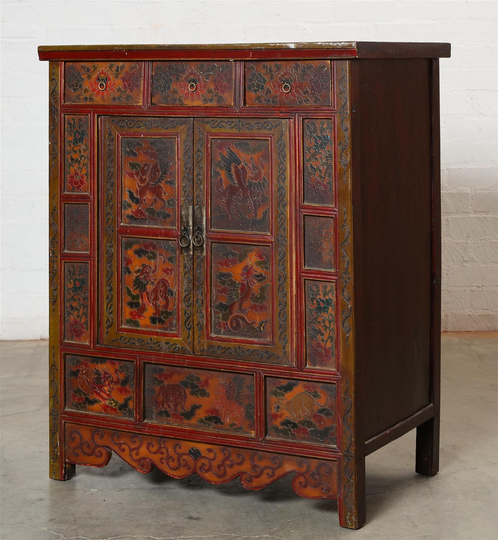A TIBETAN LACQUERED CABINETA