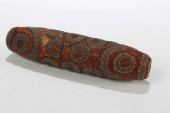A TIBETAN RELIGIOUS DZI BEAD<b
