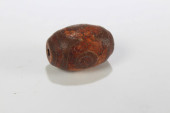 A TIBETAN RELIGIOUS DZI BEAD<b