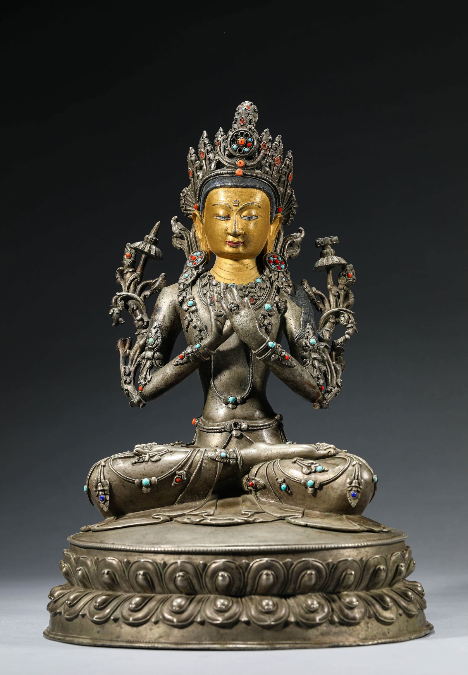 A TIBETAN SILVER MANJUSHRI