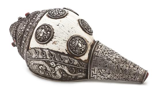 A Tibetan Silver Repousse Mounted