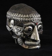 A Tibetan white metal mounted