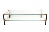 A TIERED GLASS COCKTAIL TABLE