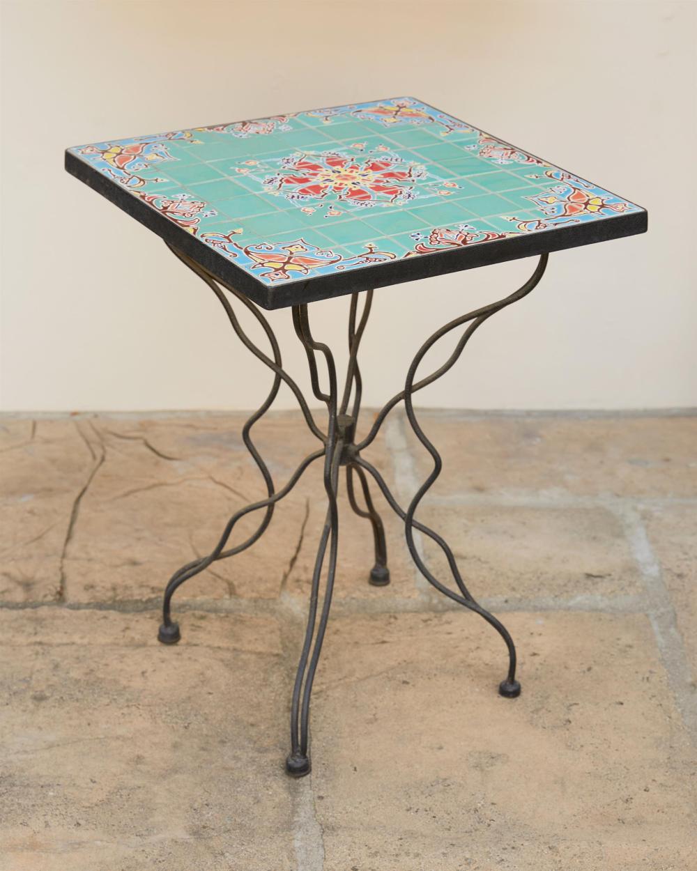 A TILE-TOP WROUGHT IRON GARDEN