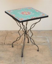 A TILE-TOP WROUGHT IRON GARDEN
