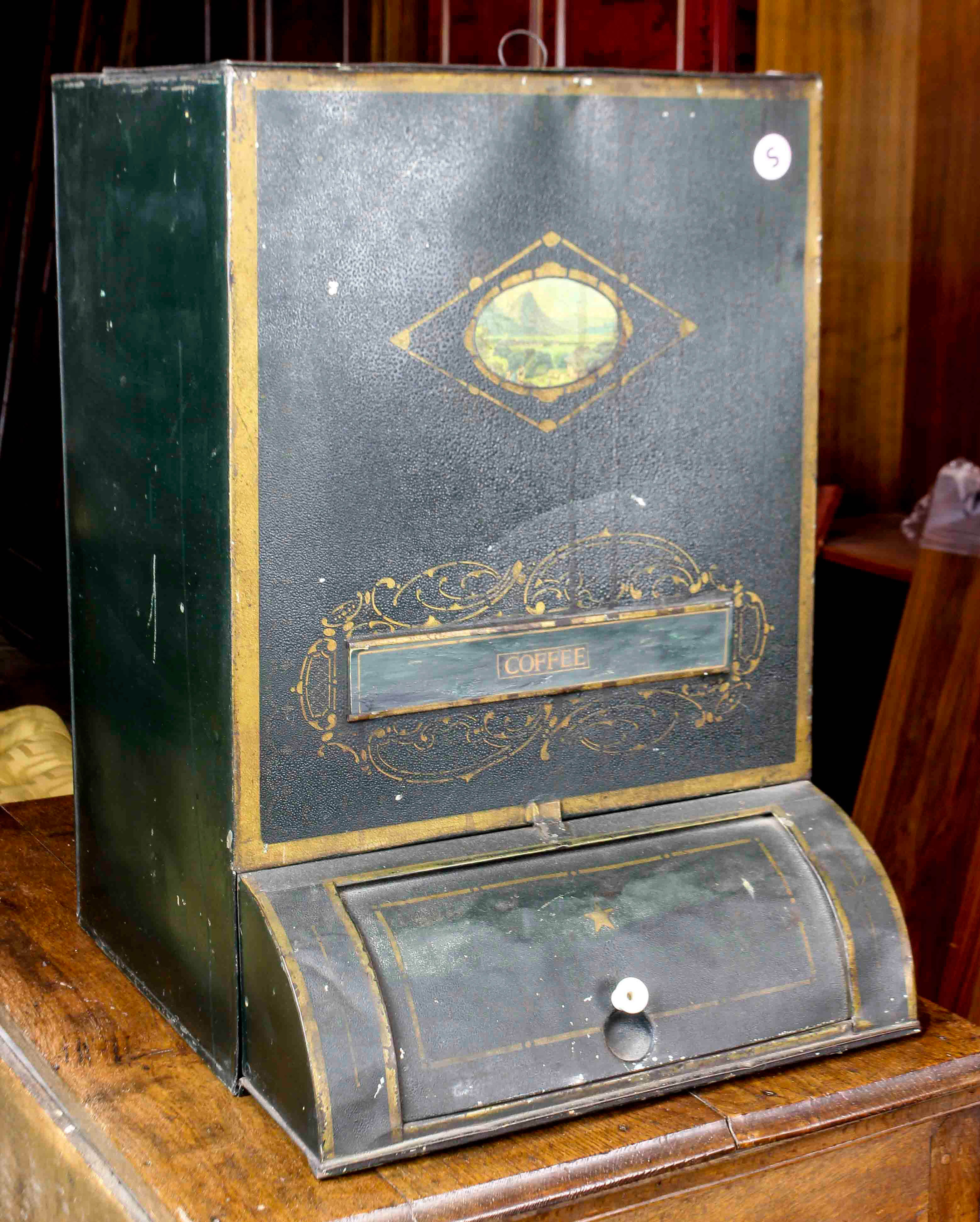 A TIN CANNISTER A tin cannister,