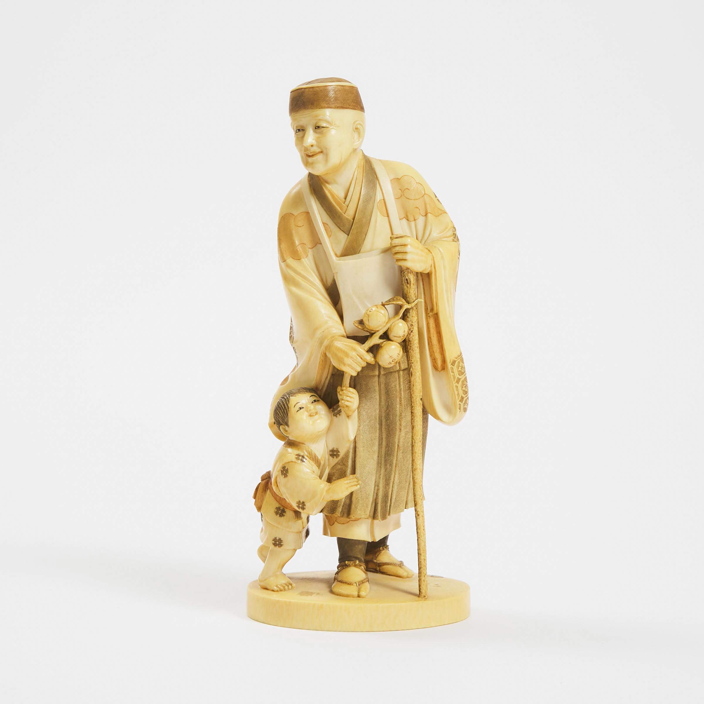 A Tinted Ivory Okimono of a Monk