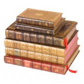 A TOOLED LEATHER BOOK FORM TAN
