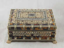 A tortoiseshell and engraved