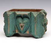 A TRAMP ART BOX WITH HEART IN
