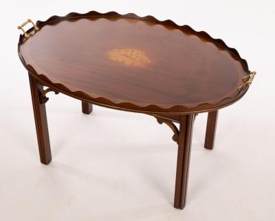 A tray top coffee table, the oval