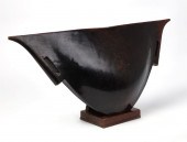 A TRIBAL CARVED WOOD VESSELA T