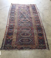 A TRIBAL FLATWEAVE KILIM RUNNE