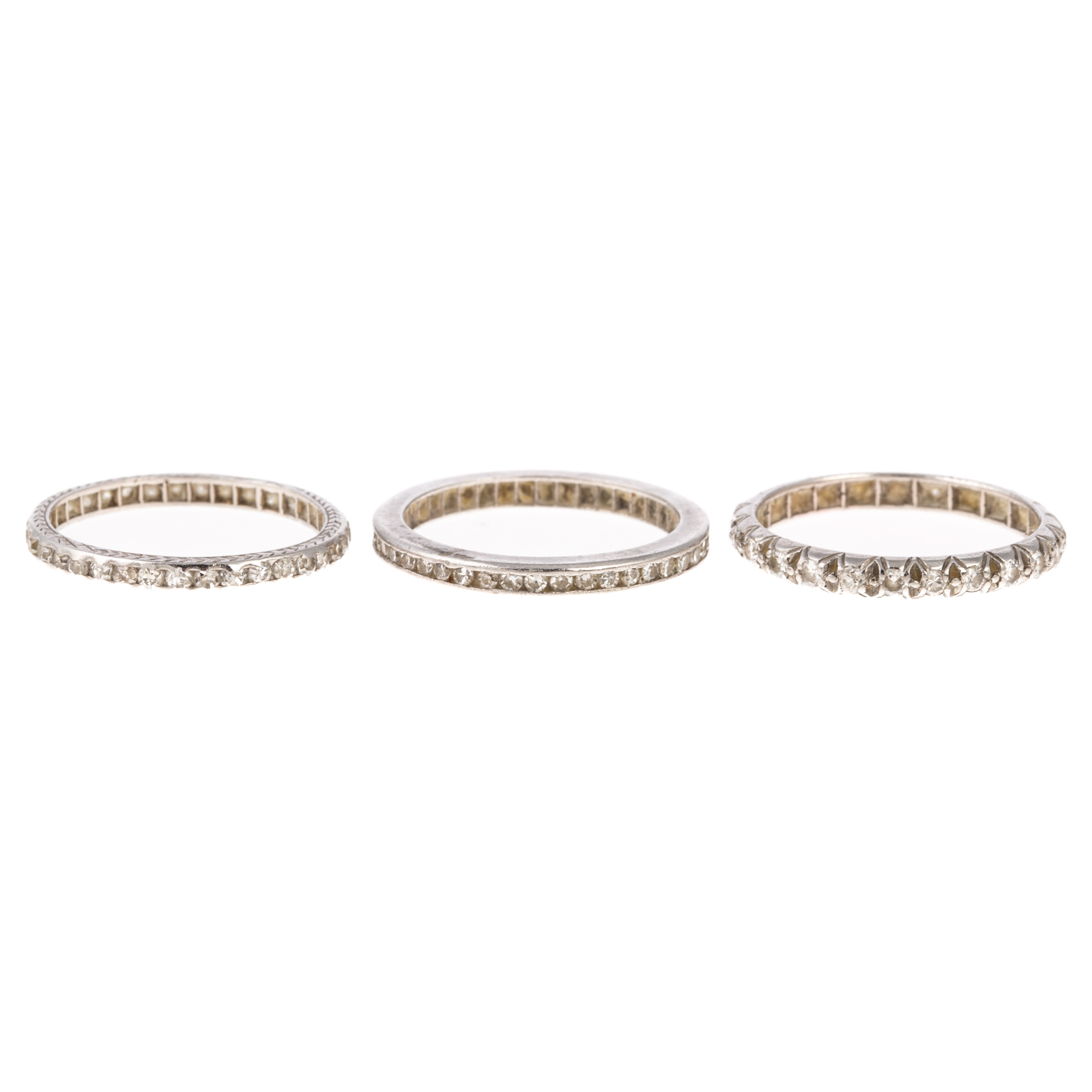 A TRIO OF ART DECO DIAMOND BANDS IN