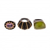 A TRIO OF BLACK RINGS WITH 14K