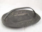 A Tudric pewter dish with hand