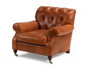 A TUFTED LEATHER CLUB ARMCHAIR