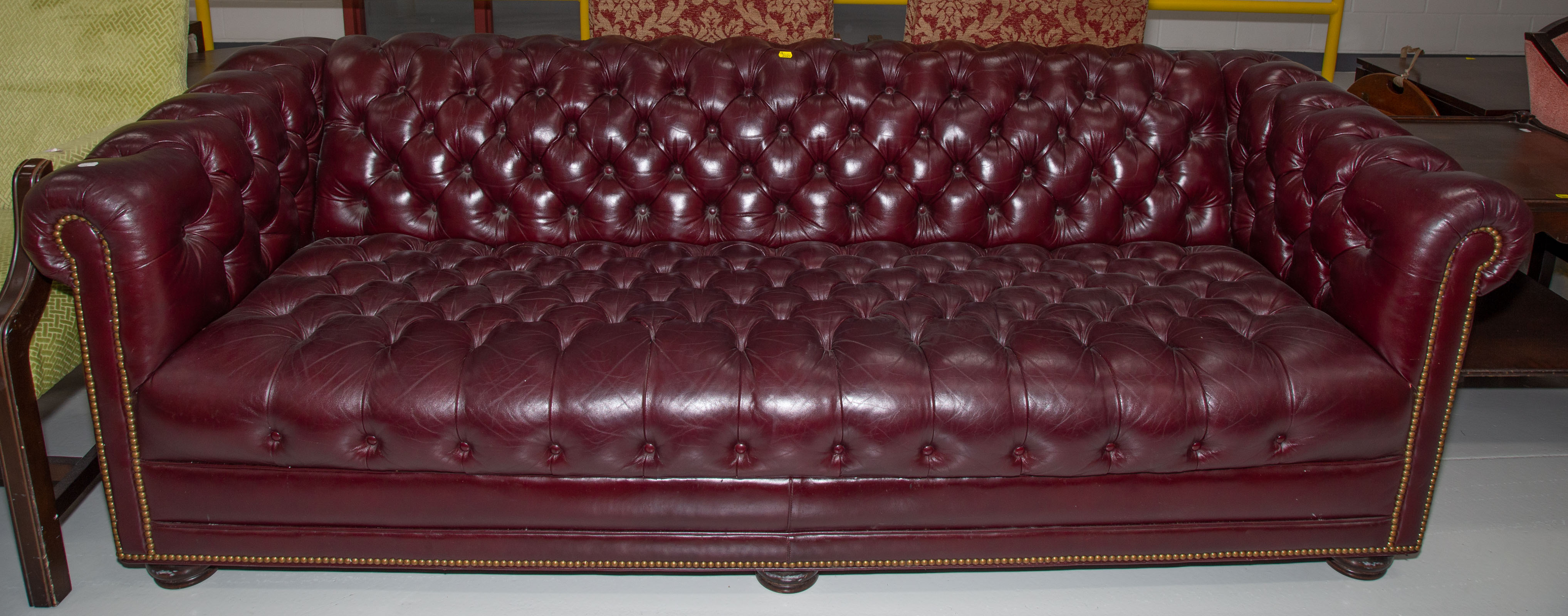A TUFTED LEATHER SOFA 3rd