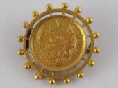 A Tunisian 20 Franc gold coin
