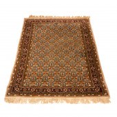 A TURKISH HEREKE CARPET A Turk