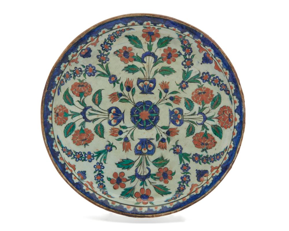 A TURKISH RIMLESS POTTERY DISH,