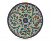 A TURKISH RIMLESS POTTERY DISH