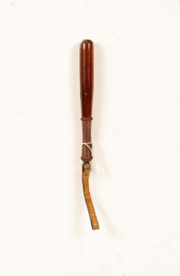 A turned wood and leather wrapped