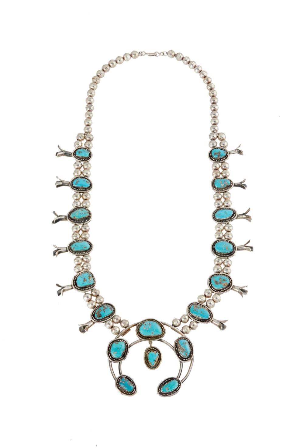 A TURQUOISE SQUASH BLOSSOM