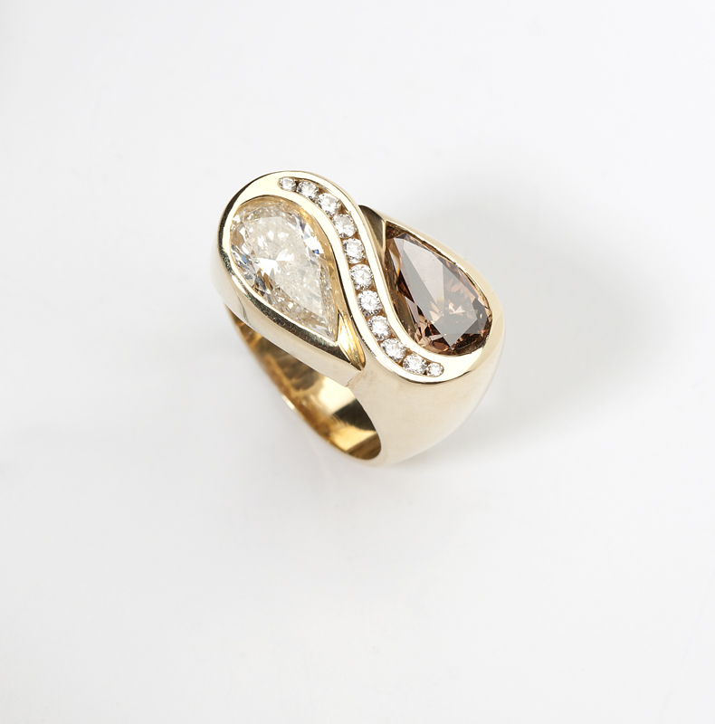 A twin pear-shaped diamond and gold