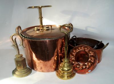A two-handled copper pan with