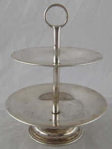 A two tier silver sweets dish
