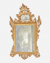 A VENETIAN CARVED GILTWOOD WAL