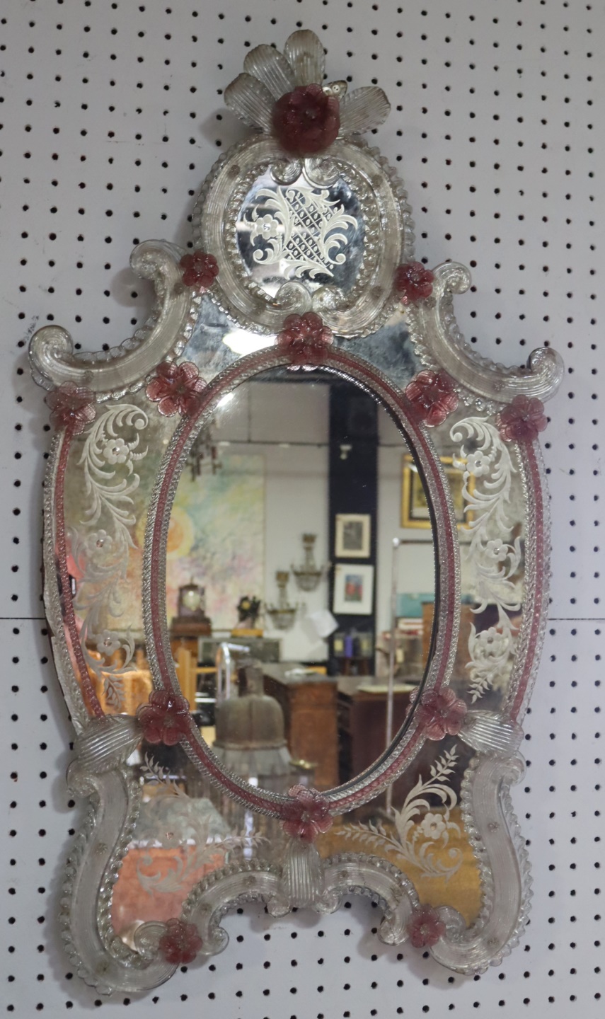 A VENETIAN GLASS MIRROR WITH PINK