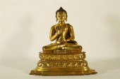 A VERY RARE GILT-BRONZE FIGURE