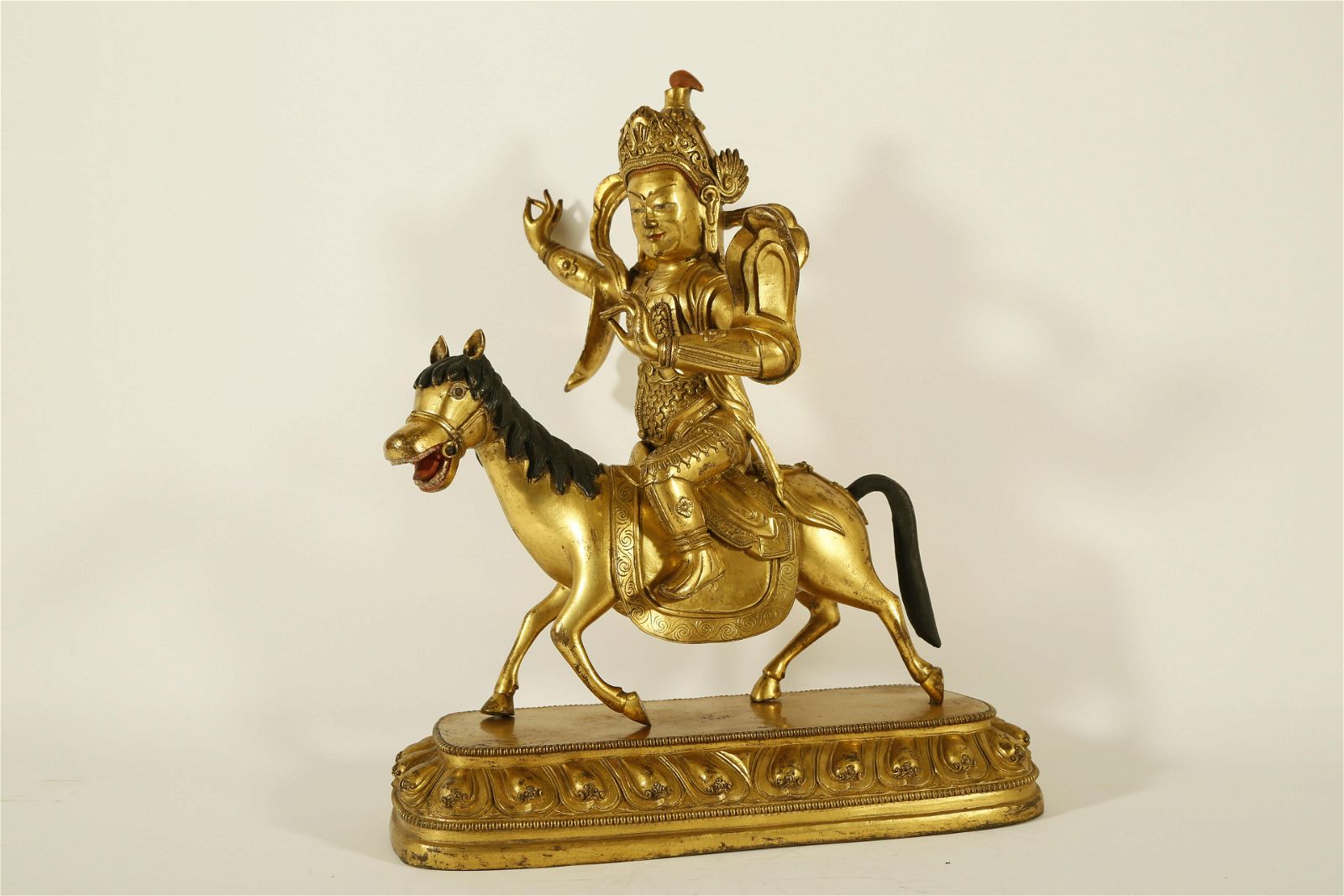 A VERY RARE GILT-BRONZE FIGURE OF
