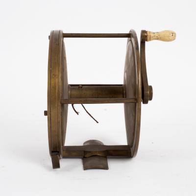 A Victorian brass fishing reel
