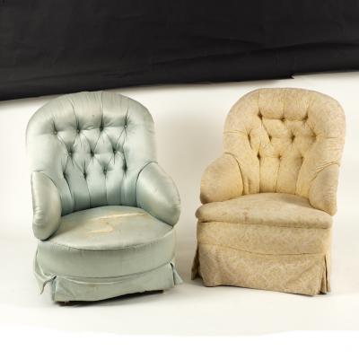 A Victorian button back armchair on
