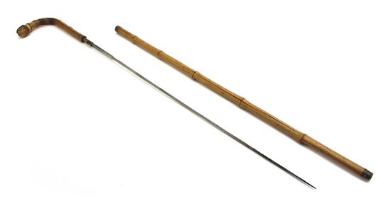 A Victorian Carved Bamboo Cane