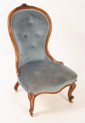 A Victorian fireside chair wit