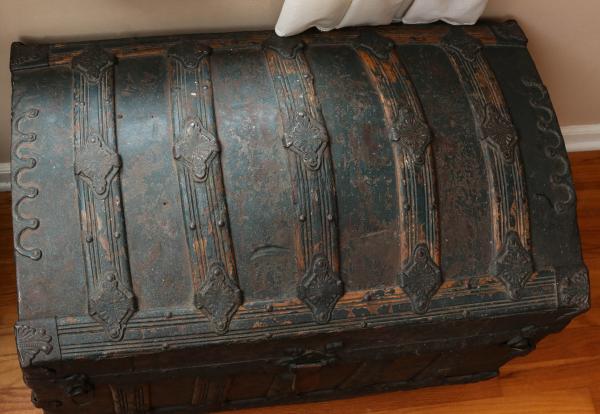 A VICTORIAN HUMP BACK TRUNK IN
