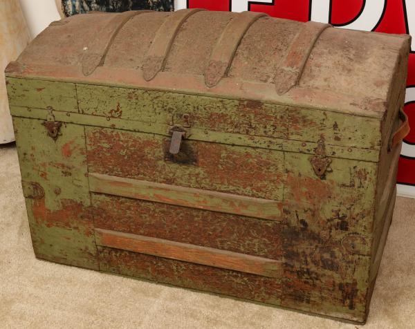 A VICTORIAN HUMP BACK TRUNK IN