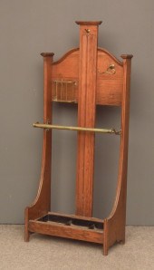 A Victorian oak and brass moun