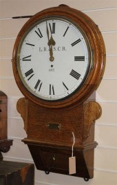 A Victorian oak drop dial wall