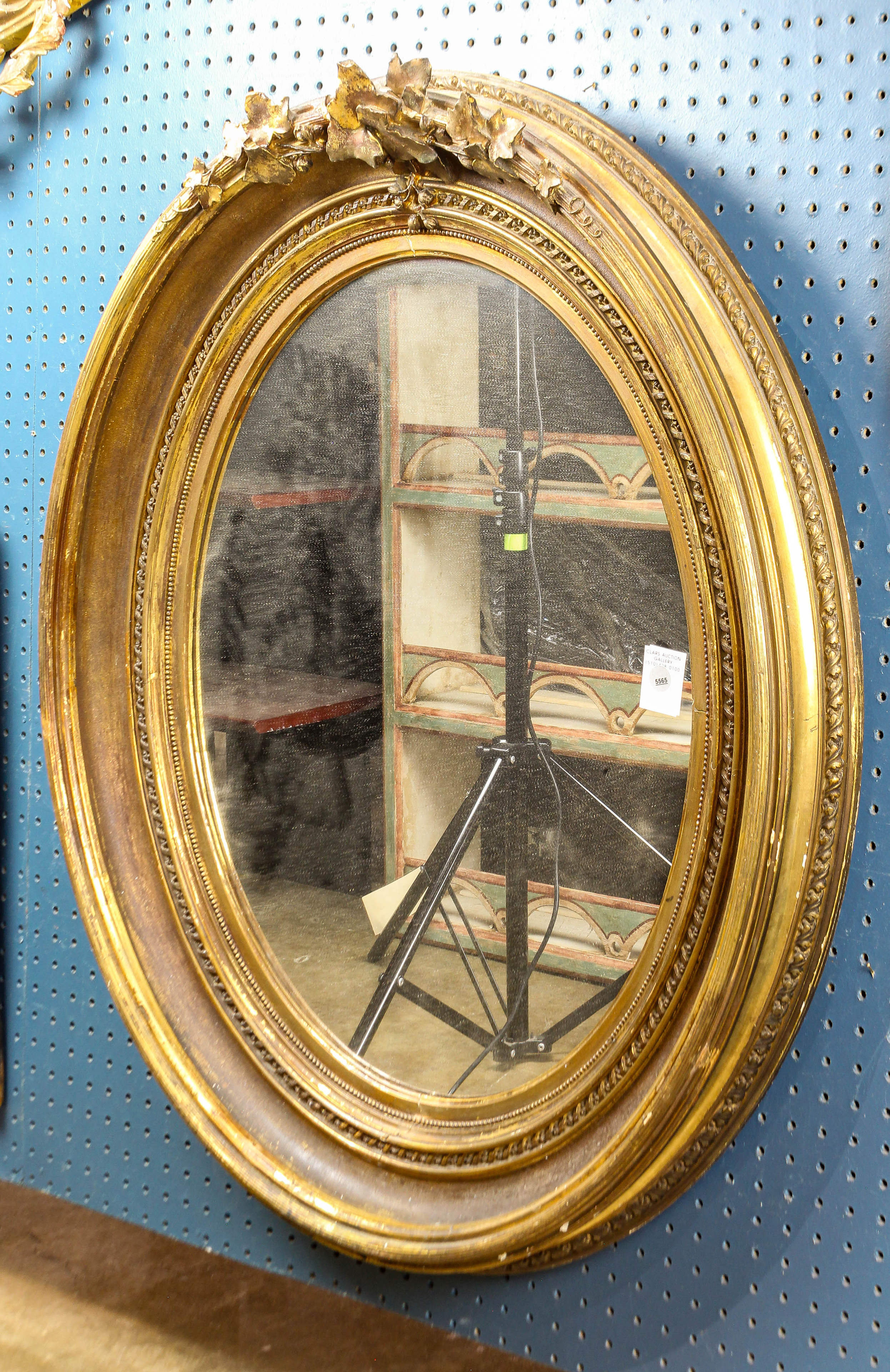 A VICTORIAN OVAL LOOKING GLASS